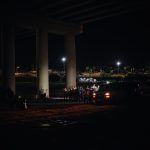 Immigrants in the custody await border patrol in Eagle Pass, Texas.