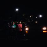 Immigrants in the custody await border patrol in Eagle Pass, Texas.