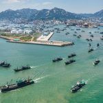 Fleet of fishing vessels leaving Shidao for start of fishing season, via Dazhong Daily, September 2022